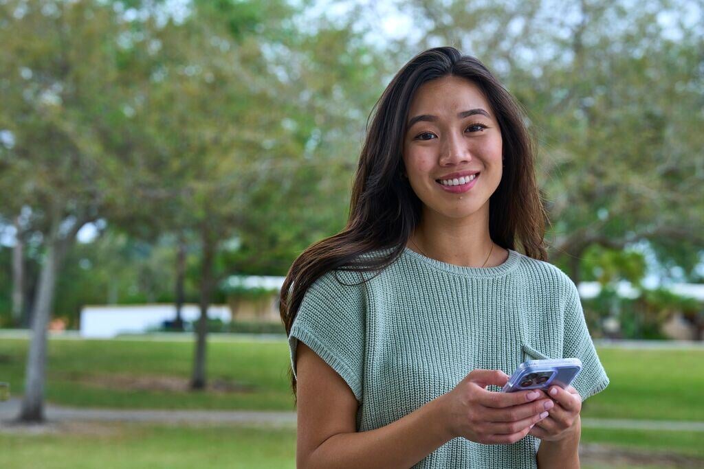 Website Featured_JPG-3555_Custom Photo_Female patient on mobile